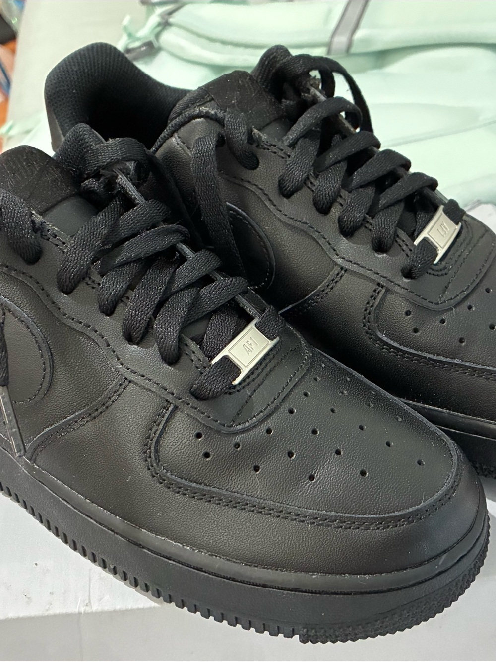 Women’s Black Low-Top Leather Nike Air Force 1 Sneakers